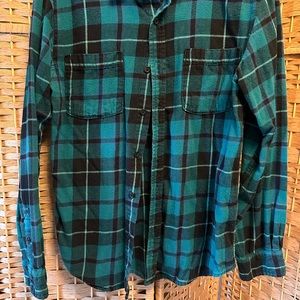 Turquoise/black checker print flannel brand is quicksilver. Lightly worn